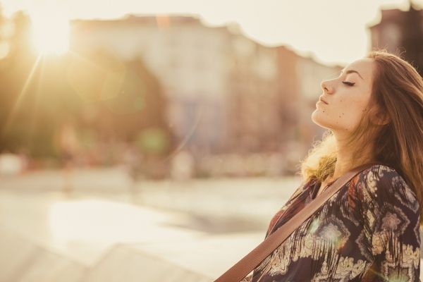 Woman meditating outdoors in Los Angeles, guided by trauma therapist