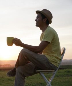 A person reflecting during sunset, symbolizing the impact of emotionally immature parents on adult children in Los Angeles trauma therapy.