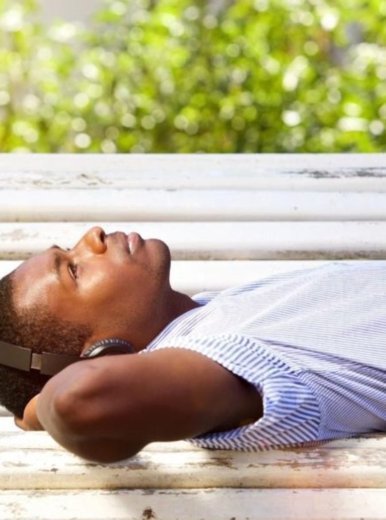 man in los angeles seeking trauma therapy in los angeles. man is looking at sky and laying on ground.