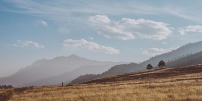 online therapy california for remote residents: desolate mountain scape with brown brush, mountains, and blue sky in california